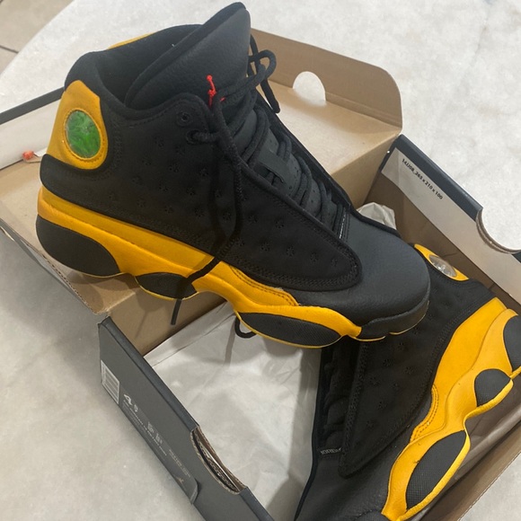 black and yellow jordans 13